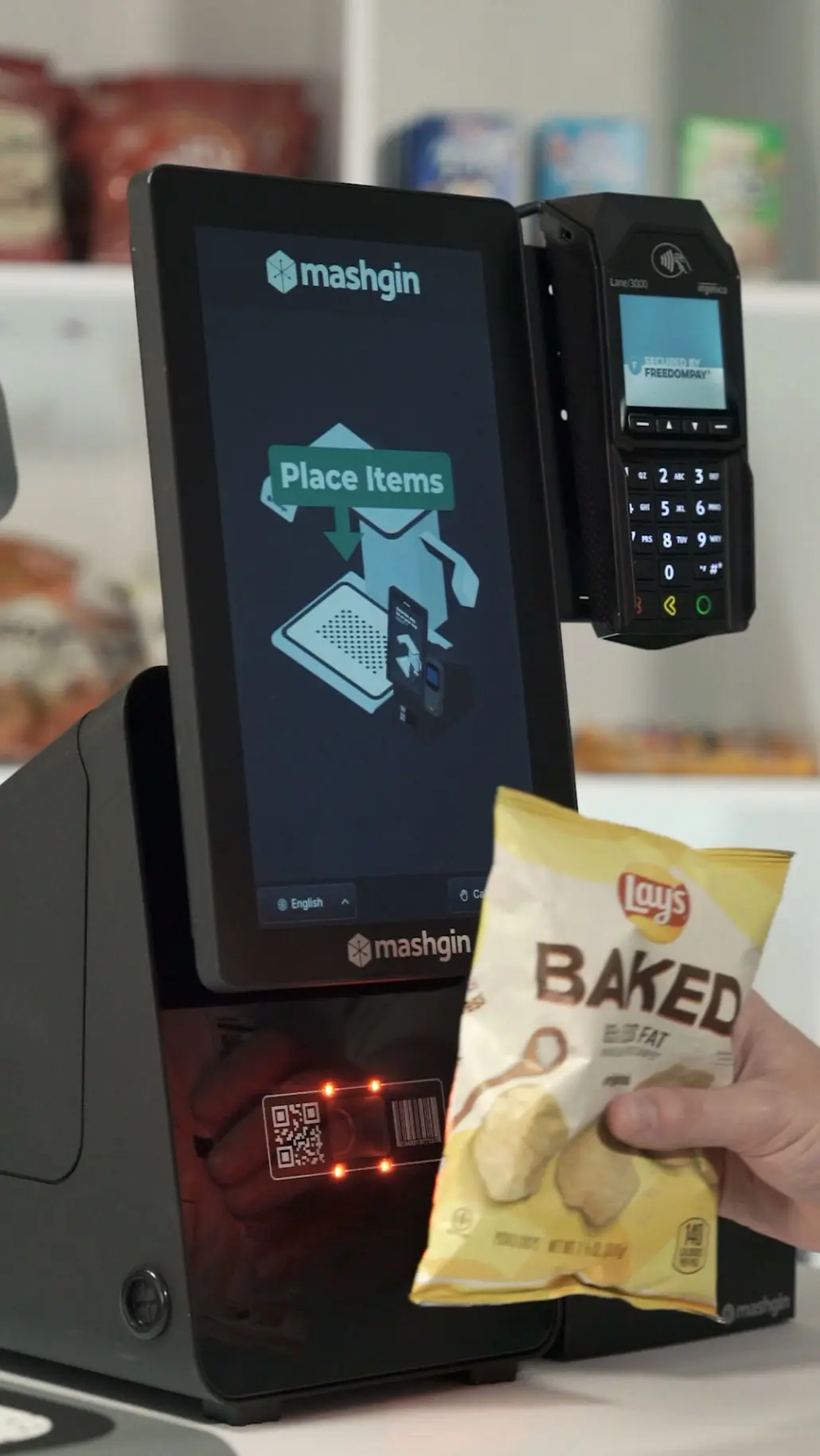 Someone scans a bag of Lays Baked potato chips with a Mashgin side scanner.